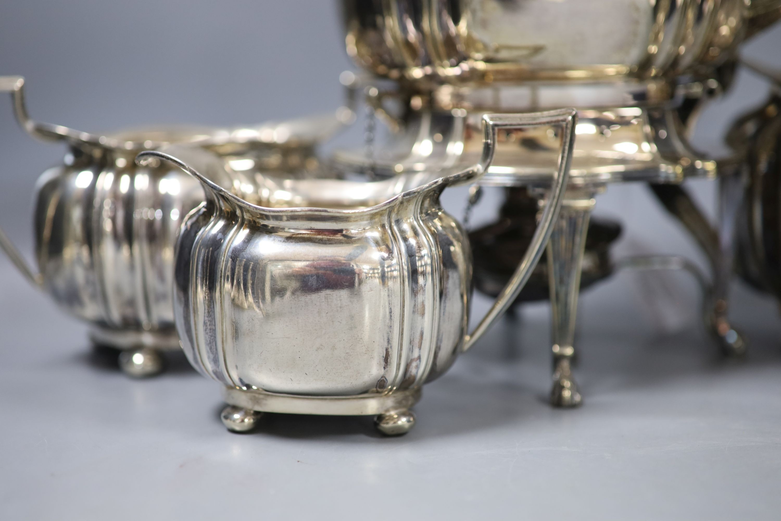 A George V silver three piece tea set, Cooper Brothers & Sons, Sheffield, 1913, gross 42oz, together with a similar plated tea kettle on stand with burner.